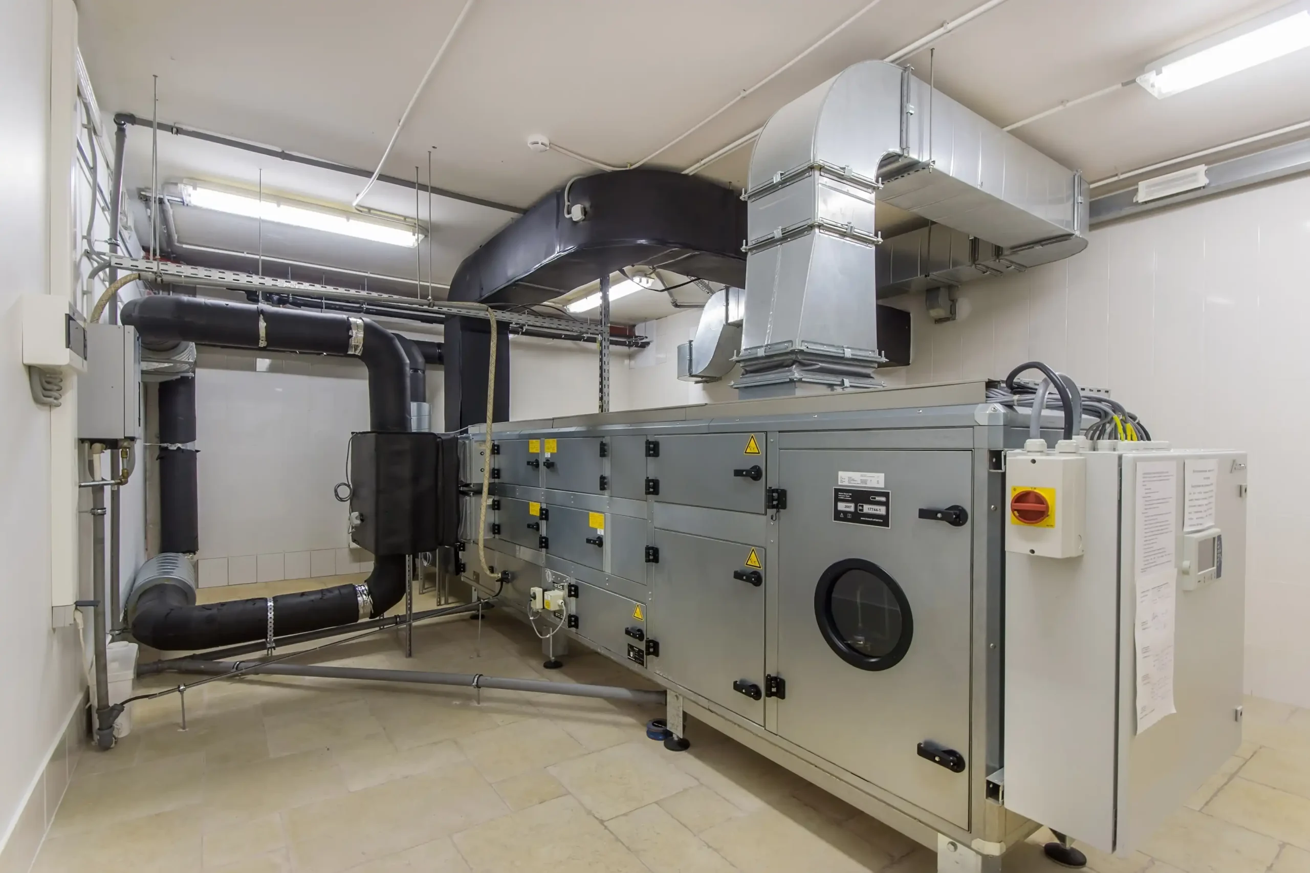 Commercial mechanical room with motors and HVAC equipment